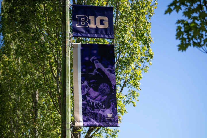 Big Ten street banner with Husky Stadium imagery