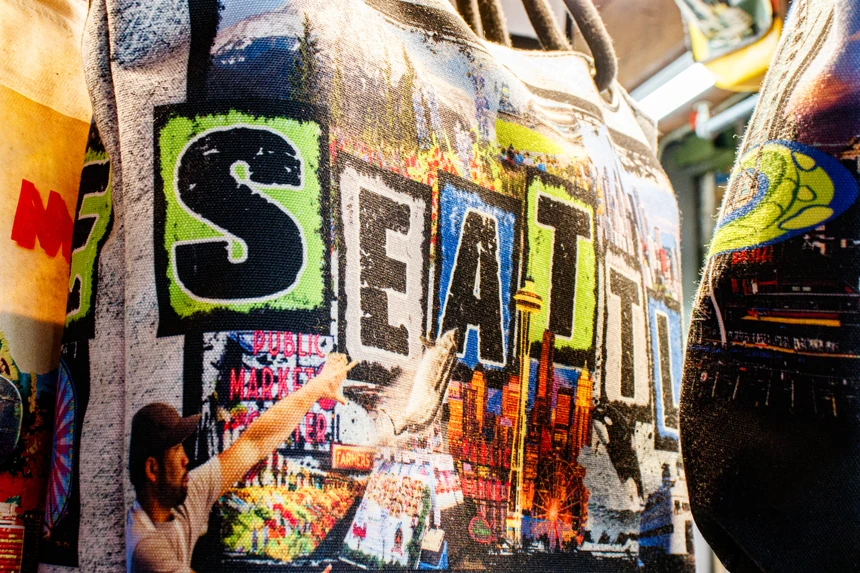Seattle lettering on a graffiti-covered pillar
