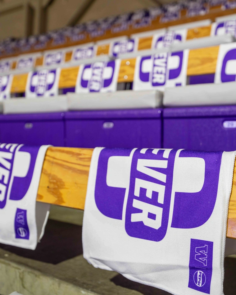 Forever 10 rally towels hanging on arena seat backs