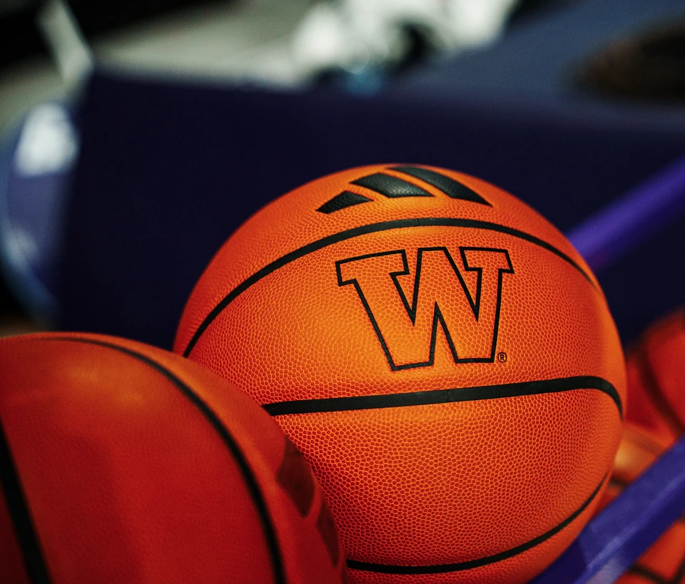 Washington basketballs on a ball rack prior to tip-off
