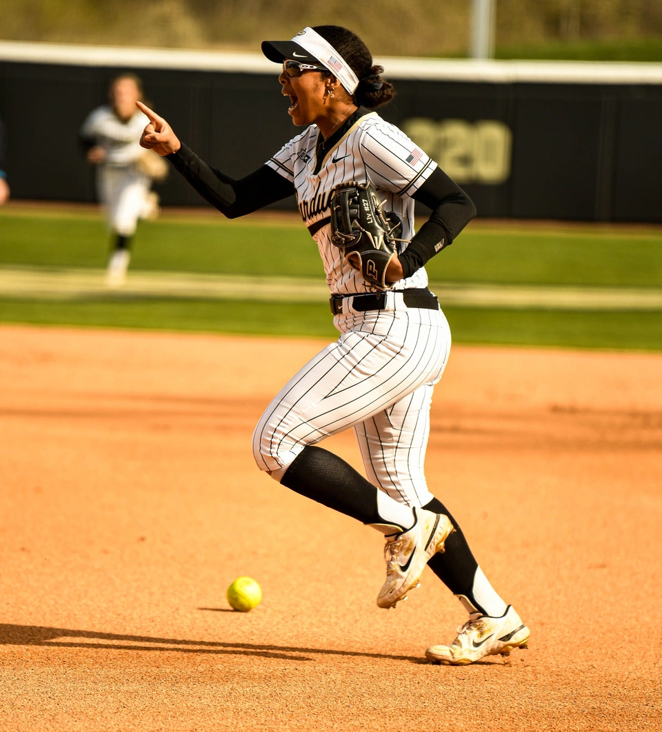 Purdue player running the bases