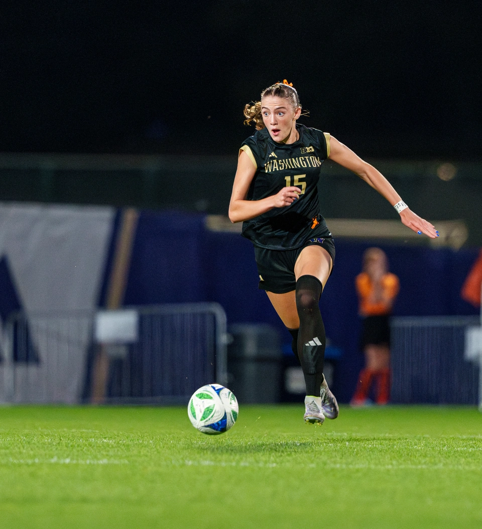 Washington forward Alex Buck dribbles forward