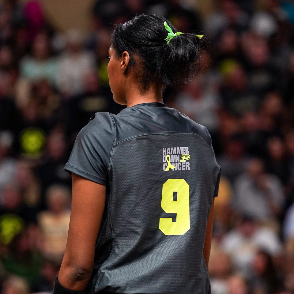 Purdue middle blocker Lourdés Myers in the Hammer Down Cancer alternate uniform